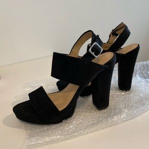 Black suede pumps